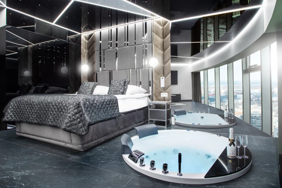 Jacuzzi by the window in a Deluxe apartment