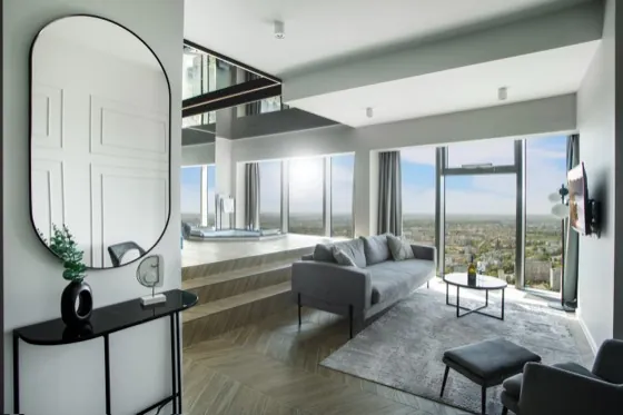 Lounge of the Executive Suite with an in-room bathtub